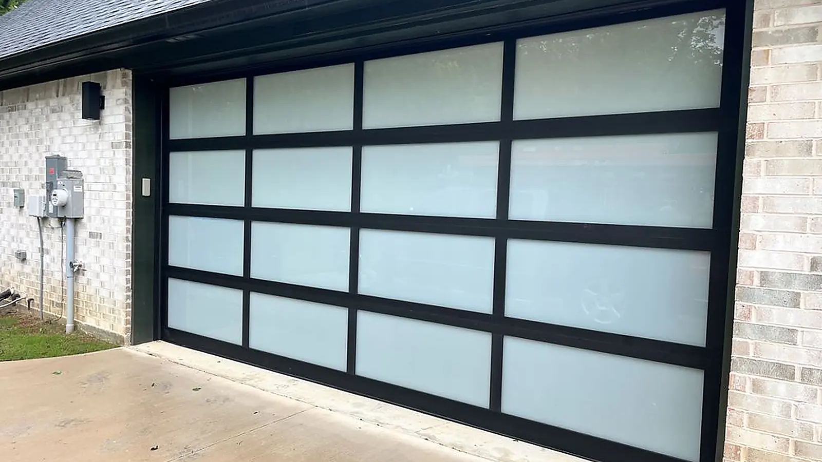 Full-view garage door freshly adjusted and balanced during a tune-up service